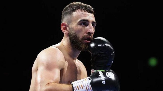 Collins stopped by Davies in seventh round