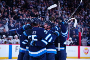 Mark Scheifele Scores Twice as Jets Beat Blackhawks in Overtime