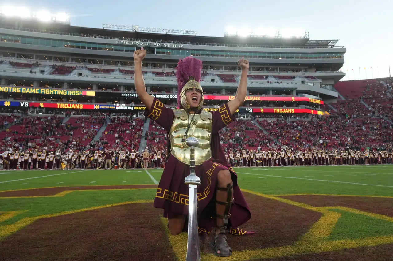 Southern California Trojans mascot Tommy Trojan leads the Spirit of Troy marching band onto the field before the game against the Notre Dame Fighting Irish at United Airlines Field at Los Angeles Memorial Coliseum.