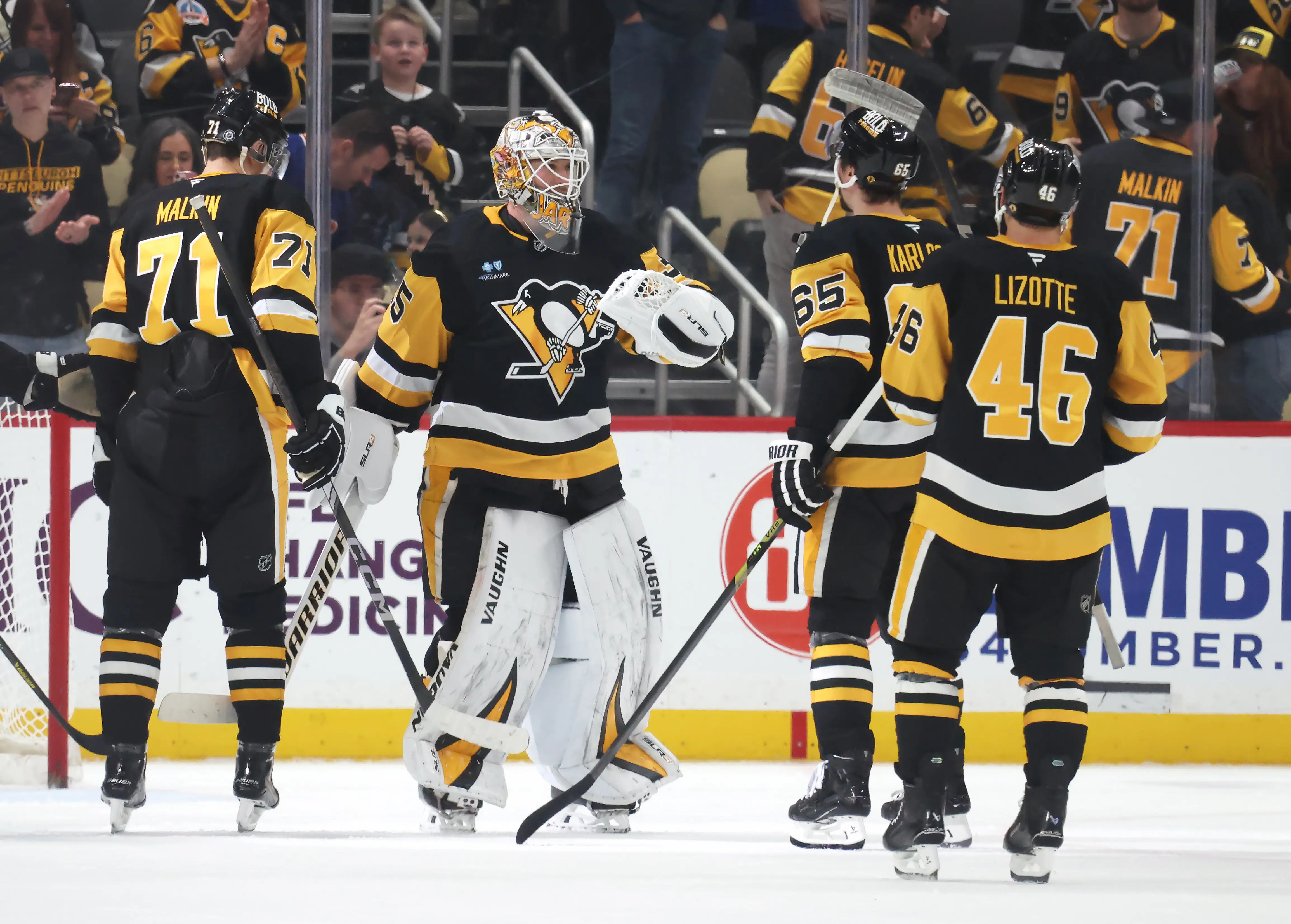 Mar 13, 2025; Pittsburgh, Pennsylvania, USA; Pittsburgh Penguins center Evgeni Malkin (71) and goaltender Tristan Jarry (35) and defenseman Erik Karlsson (65) and center Blake Lizotte (46) celebrate after defeating the St. Louis Blues at PPG Paints Arena. (Charles LeClaire-Imagn Images)