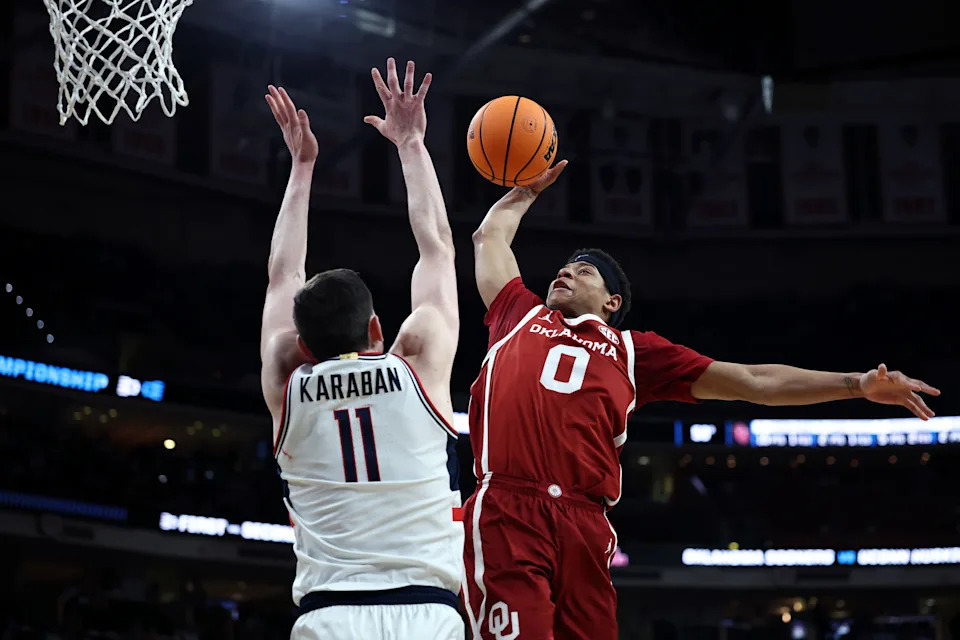 RALEIGH, NORTH CAROLINA - MARCH 21: Jeremiah Fears #0 of the Oklahoma Sooners goes to the basket while defended by Alex Karaban #11 of the Connecticut Huskies during the second half in the first round of the NCAA Men's Basketball Tournament at Lenovo Center on March 21, 2025 in Raleigh, North Carolina. (Photo by Jared C. Tilton/Getty Images)