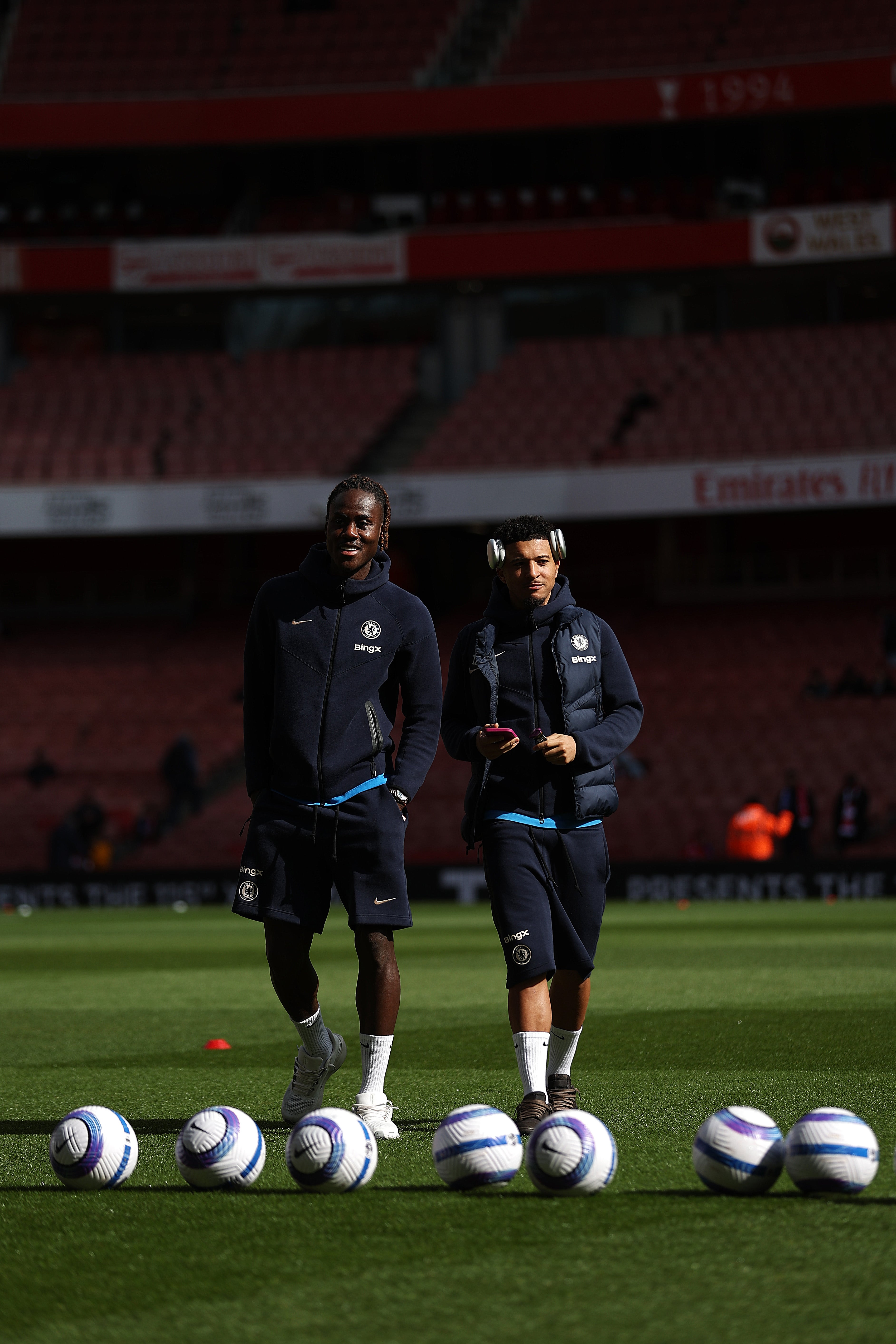 Trevoh Chalobah and Jadon Sancho of Chelsea inspect the pitch