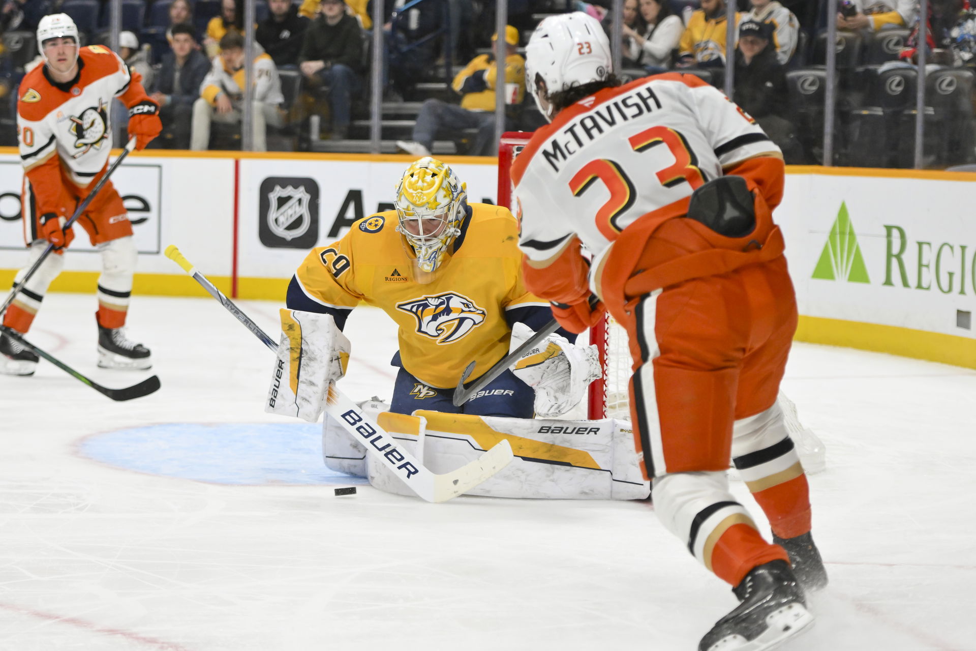 Mar 20, 2025; Nashville, Tennessee, USA; Nashville Predators goaltender Justus Annunen (29) blocks the shot of Anaheim Ducks center Mason McTavish (23) during the second period at Bridgestone Arena. Mandatory Credit: Steve Roberts-Imagn Images