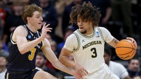 2025 March Madness scores, takeaways: Kansas bows out early, Michigan survives on Day 1 of NCAA Tournament