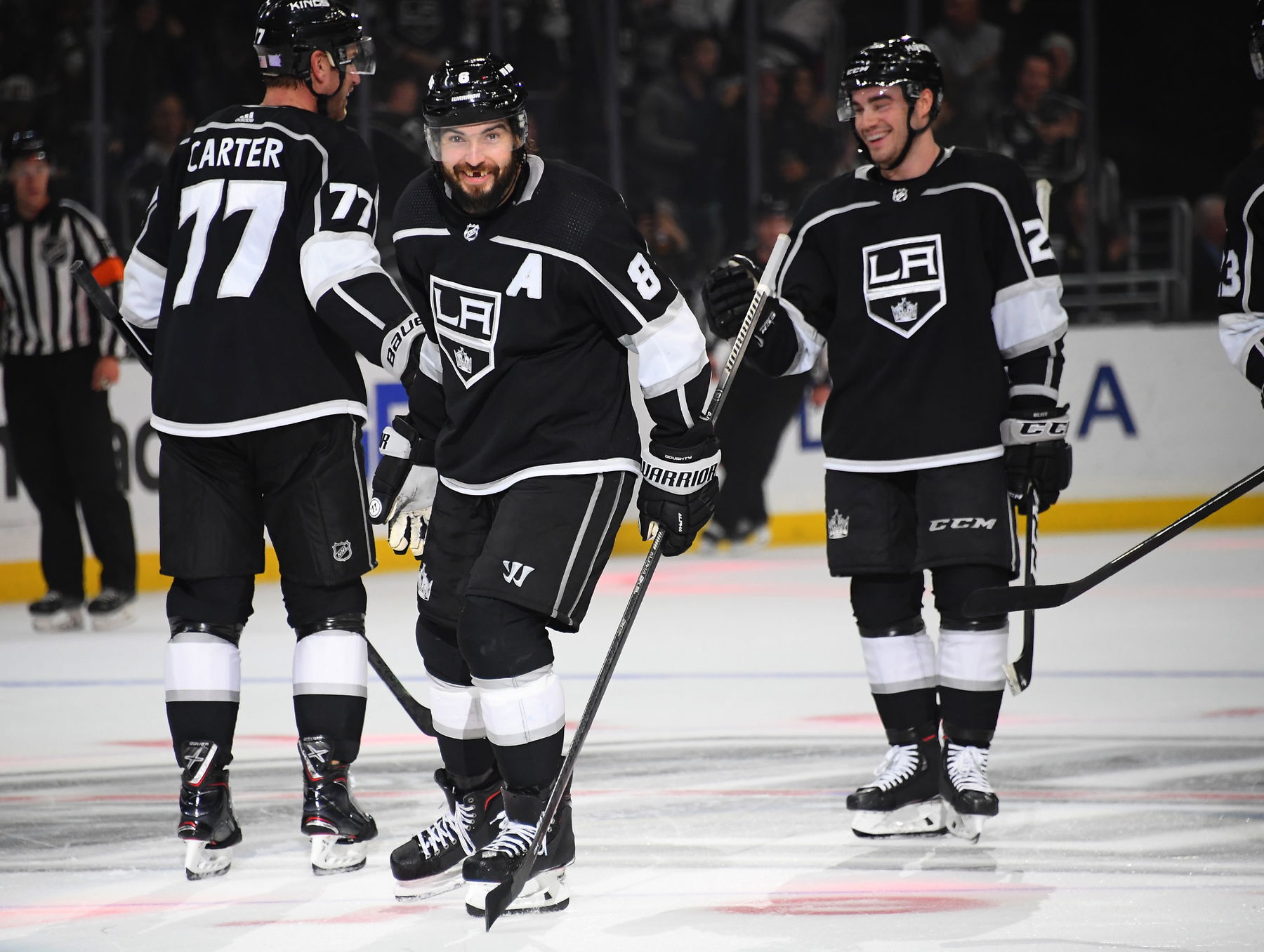 Nov 12, 2019; Los Angeles, CA, USA; Los Angeles Kings defenseman Drew Doughty (8) celebrates with center Jeff Carter (77) after an empty net goal by defenseman Sean Walker (26) to defeat the Minnesota Wild 3-1 at Staples Center. (Jayne Kamin-Oncea-Imagn Images)