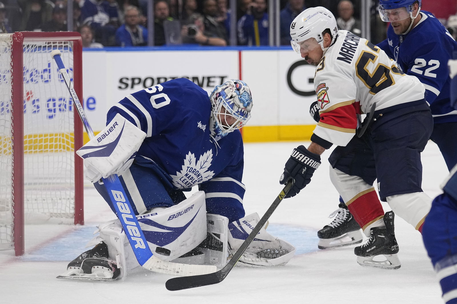 May 14, 2025; Toronto, Ontario, CAN; Toronto Maple Leafs goaltender Joseph Woll (60) makes a save against Florida Panthers forward Brad Marchand (63) during the second period of game five of the second round of the 2025 Stanley Cup Playoffs at Scotiabank Arena. (Credit: John E. Sokolowski-Imagn Images)