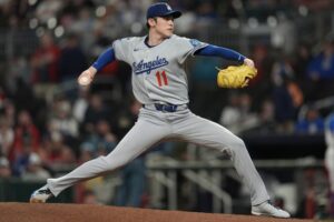Dodgers wait out the rain and Roki Sasaki escapes danger for seventh straight win