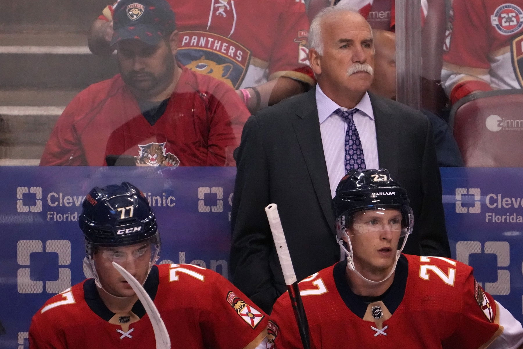 Oct 27, 2021; Sunrise, Florida, USA; Florida Panthers head coach Joel Quenneville watches from behind the bench during the first period between the Florida Panthers and the Boston Bruins at FLA Live Arena. Mandatory Credit: Jasen Vinlove-Imagn Images