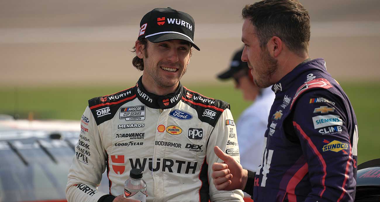 Ryan Blaney, left, chats with Alex Bowman post-race on pit road at Kansas Speedway
