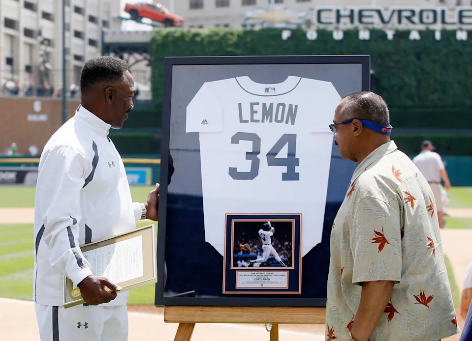 Former Detroit player Chet Lemon is presented with a framed Tigers jersey by Willie Horton before a game on June 5, 2016