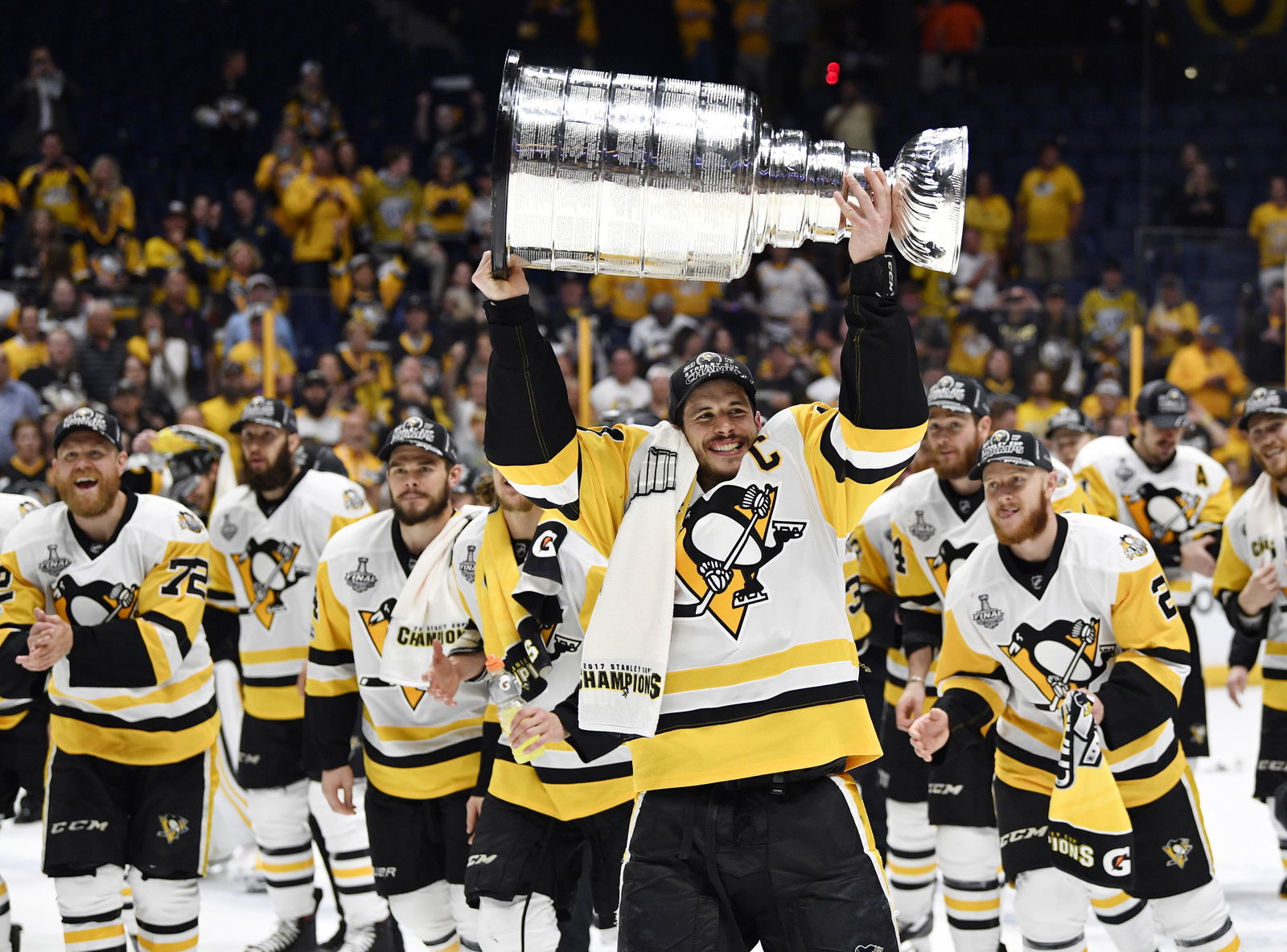 Jun 11, 2017; Nashville, TN, USA; Pittsburgh Penguins center Sidney Crosby (87) hoists the Stanley Cup after defeating the Nashville Predators in game six of the 2017 Stanley Cup Final at Bridgestone Arena. (Credit: Christopher Hanewinckel-Imagn Images)