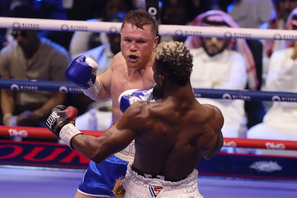 Cuba's William Scull (R) and Mexico's Canelo Alvarez fight during their super middleweight boxing match at The Venue in Riyadh on May 4, 2025. (Photo by Fayez NURELDINE / AFP) (Photo by FAYEZ NURELDINE/AFP via Getty Images)