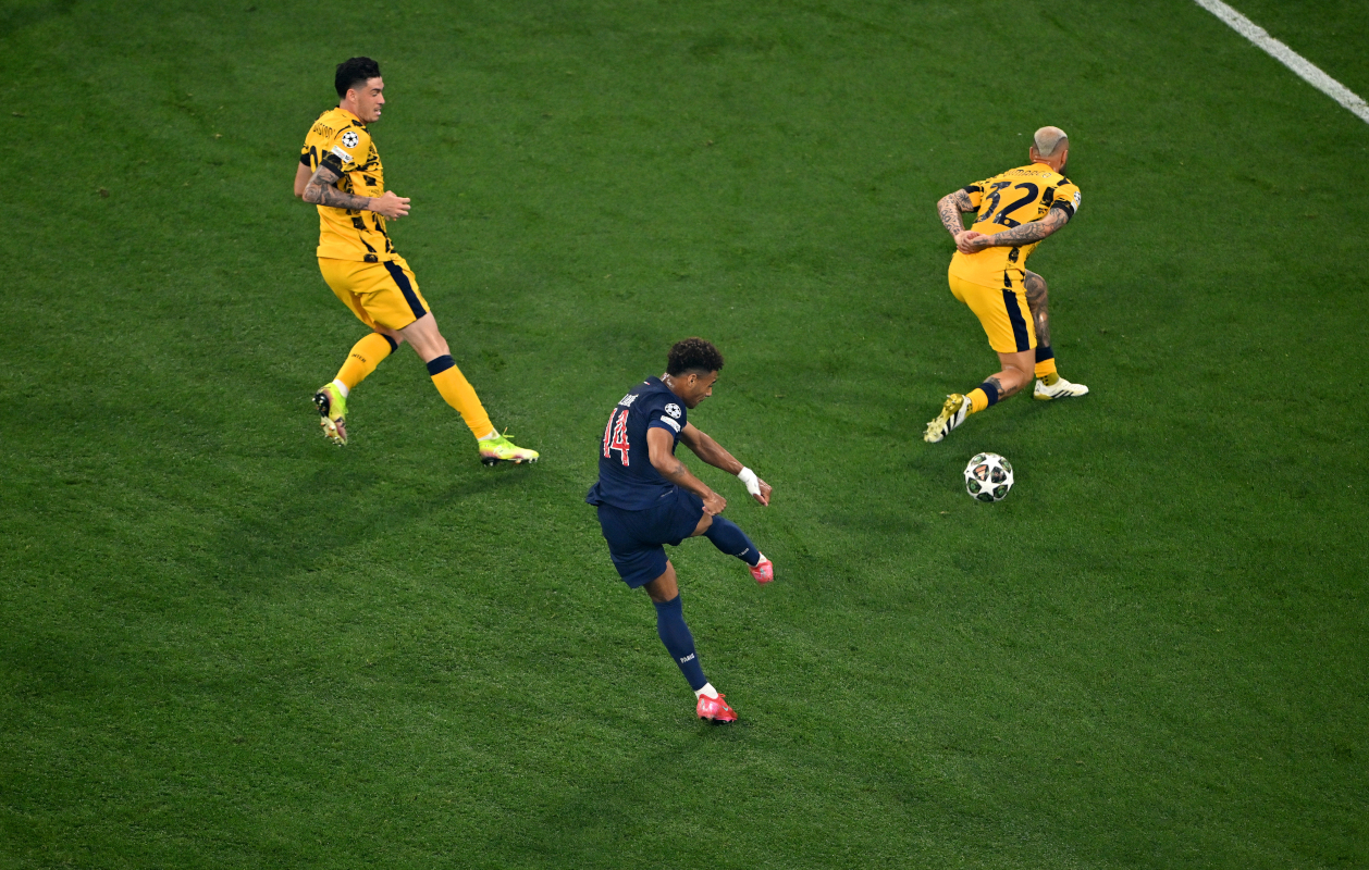 MUNICH, GERMANY - MAY 31: Desire Doue of Paris Saint-Germain scores his team's second goal whilst under pressure from Federico Dimarco and Alessandro Bastoni of FC Internazionale during the UEFA Champions League Final 2025 between Paris Saint-Germain and FC Internazionale Milano at Munich Football Arena on May 31, 2025 in Munich, Germany. (Photo by Dan Mullan/Getty Images)