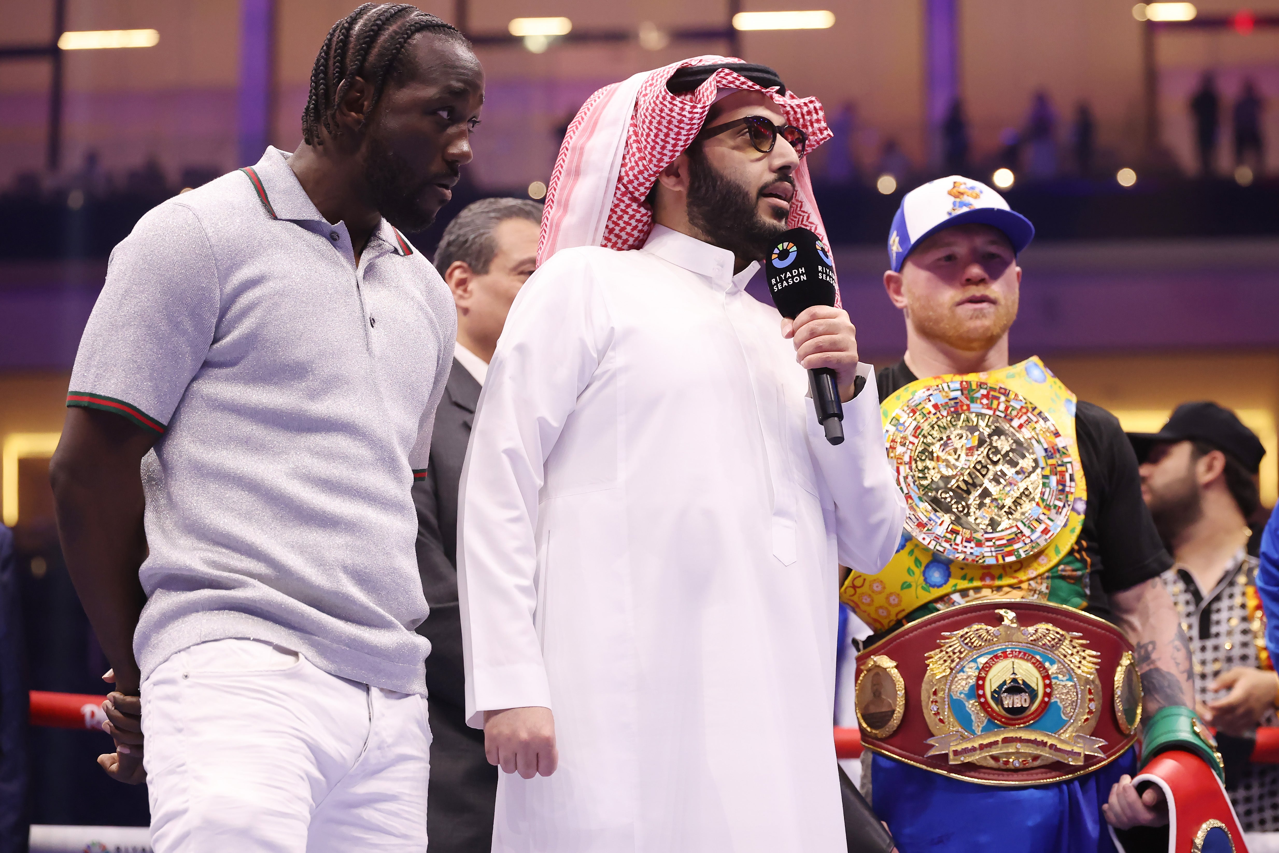 Terence Crawford (left) enters the ring before facing off with Canelo