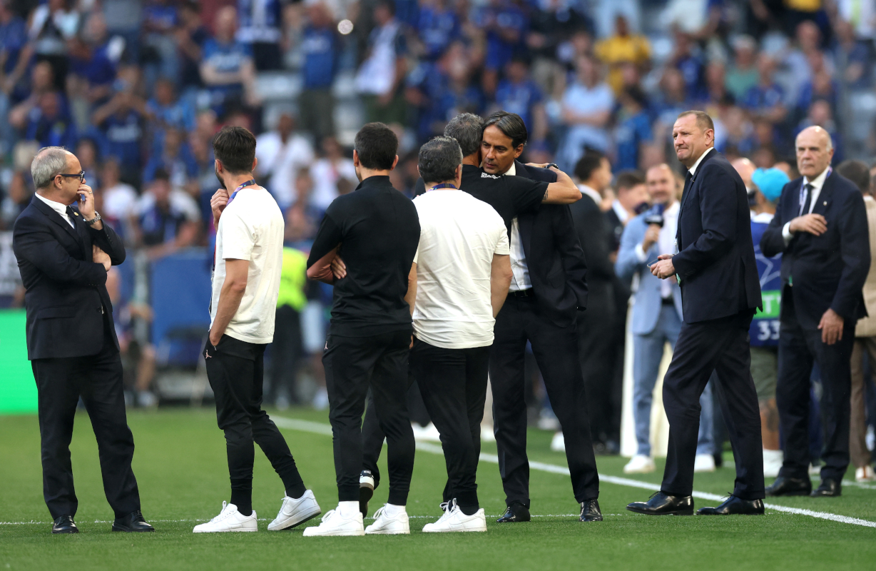 MUNICH, GERMANY - MAY 31: Luis Enrique, Head Coach of Paris Saint-Germain, embraces Simone Inzaghi, Head Coach of FC Internazionale, during a pitch inspection prior to the UEFA Champions League Final 2025 between Paris Saint-Germain and FC Internazionale Milano at Munich Football Arena on May 31, 2025 in Munich, Germany. (Photo by Carl Recine/Getty Images)