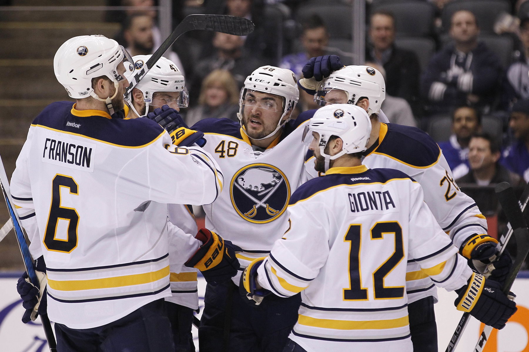 Jan 17, 2017; Toronto, Ontario, CAN; Buffalo Sabres forward William Carrier (48) celebrates his goal with defenseman Cody Franson (6) and forward Brian Gionta (12) against the Toronto Maple Leafs at the Air Canada Centre. Toronto defeated Buffalo 4-3. (John E. Sokolowski-Imagn Images)