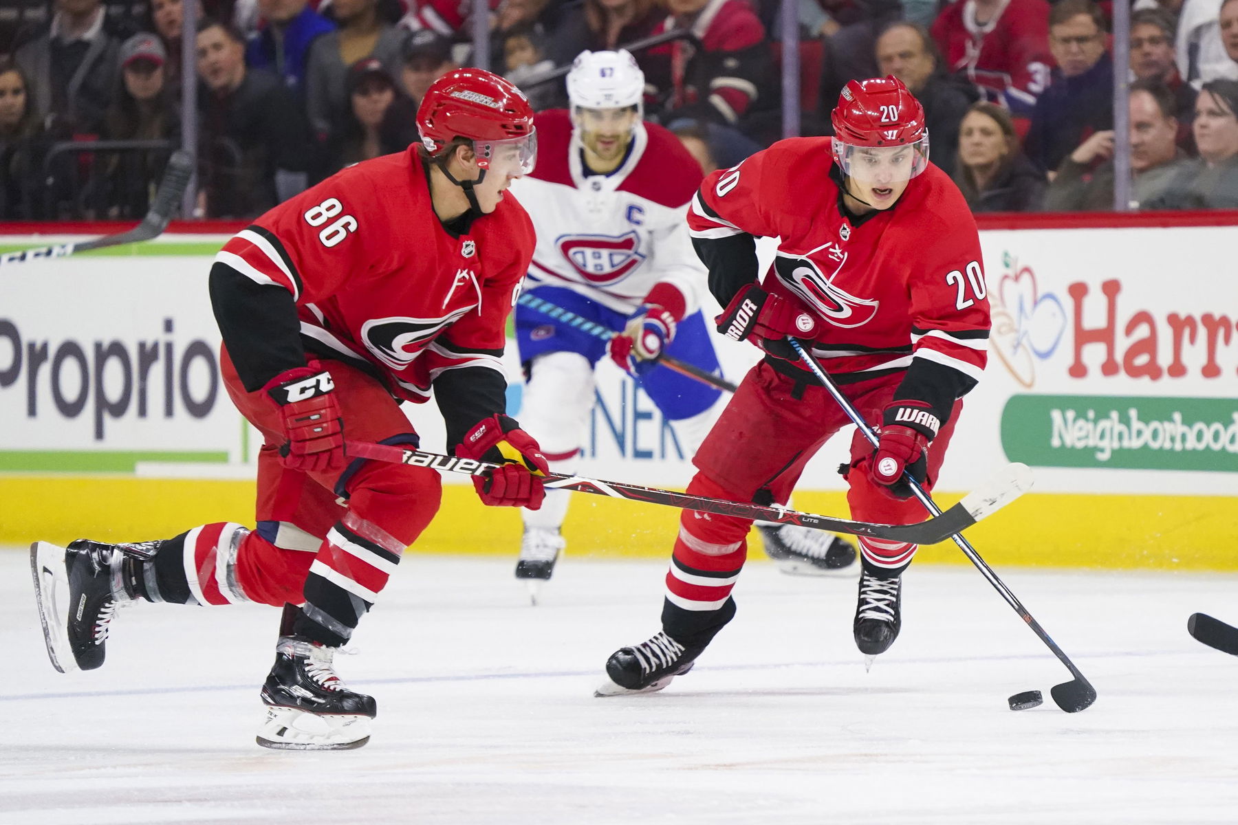 Feb 1, 2018; Raleigh, NC, USA; Carolina Hurricanes forward Sebastian Aho (20) skates with the puck with forward Teuvo Teravainen (86) against the Montreal Canadiens at PNC Arena. The Carolina Hurricanes defeated the Montreal Canadiens 2-0. (James Guillory-Imagn Images)