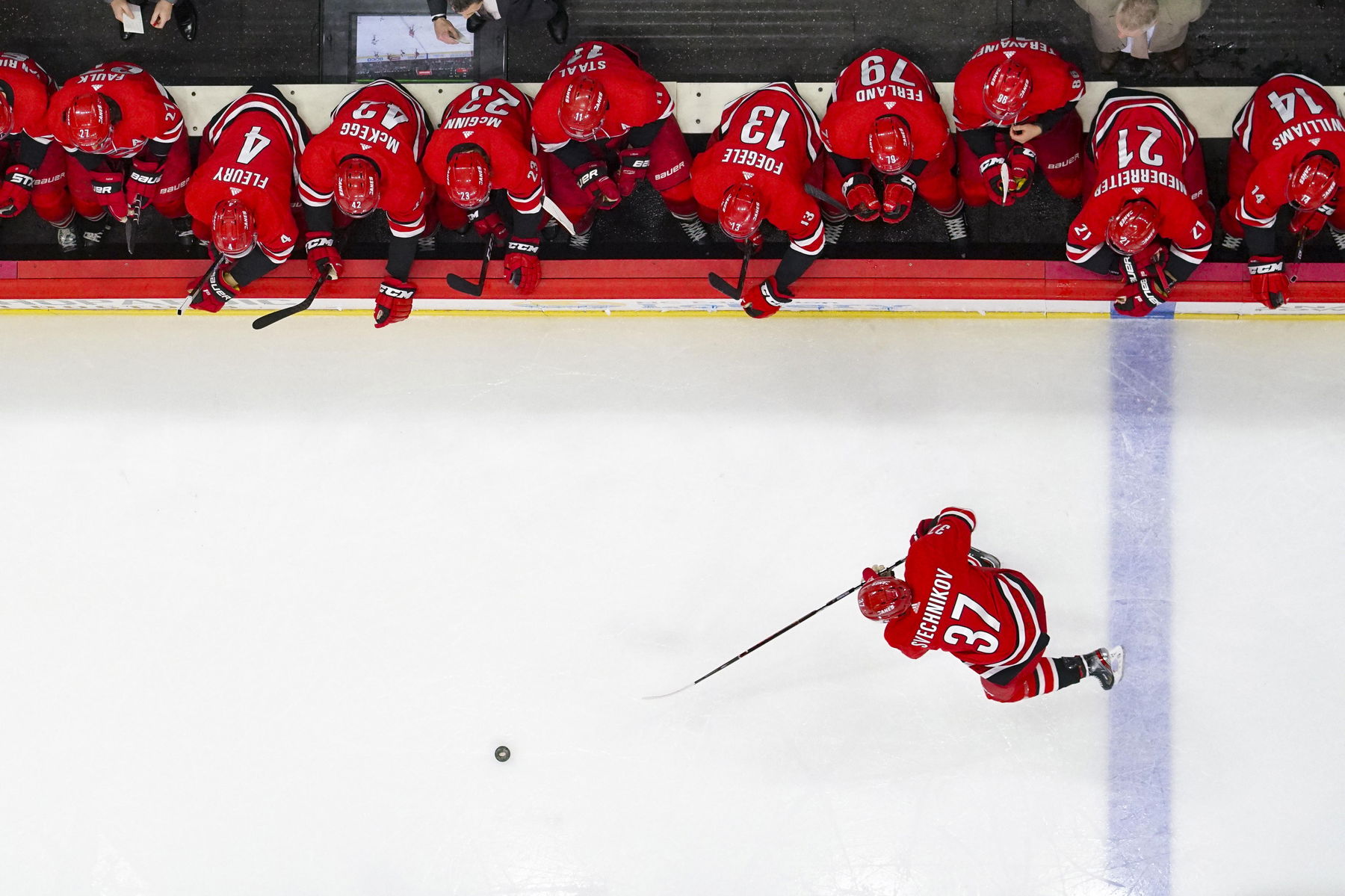 Apr 4, 2019; Raleigh, NC, USA; Carolina Hurricanes right wing Andrei Svechnikov (37) skates with the puck against the New Jersey Devils at PNC Arena. The Carolina Hurricanes defeated the New Jersey Devils 3-1. (James Guillory-Imagn Images)