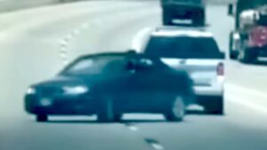 Man Arrested After Trying to Tow a Car Backwards on a Highway