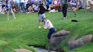 Justin Thomas’ wild round at PGA ends with shoes and socks off at 18th hole