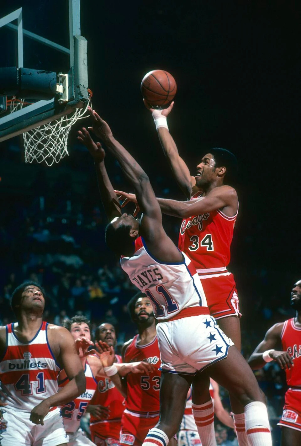 The Bulls' David Greenwood shoots over the Bullets' Elvin Hayes during a game in 1981 in Landover, Maryland.