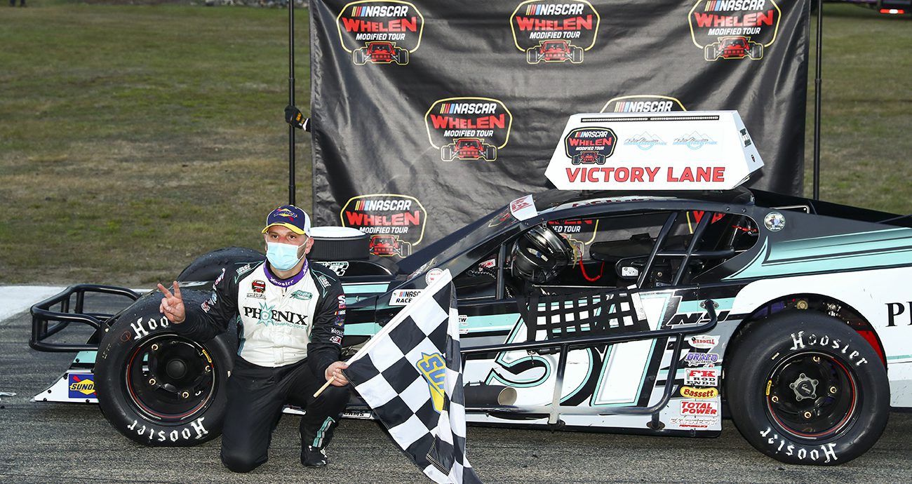 Justin Bonsignore, driver of the #51 Phoenix Communications Inc. Chevrolet, celebrates in victory lane after winning the Independence Day 200 for the NASCAR Whelen Modified Tour at White Mountain Motorsports Park in North Woodstock, New Hampshire on Saturday, July 4, 2020. (Adam Glanzman/NASCAR)