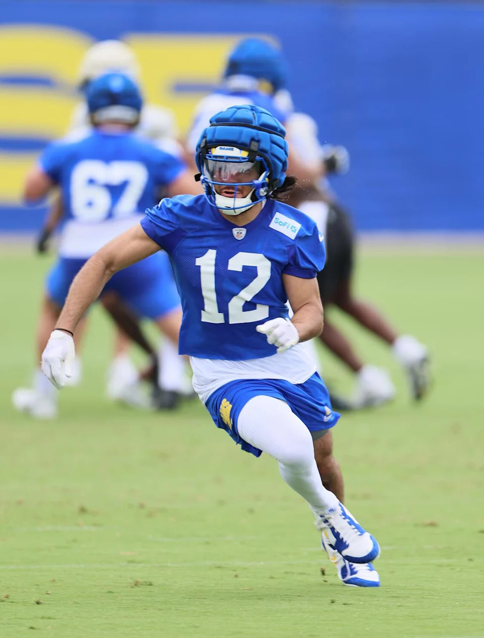 Rams wide receiver Puka Nacua runs a passing route at organized team activities on June 3.