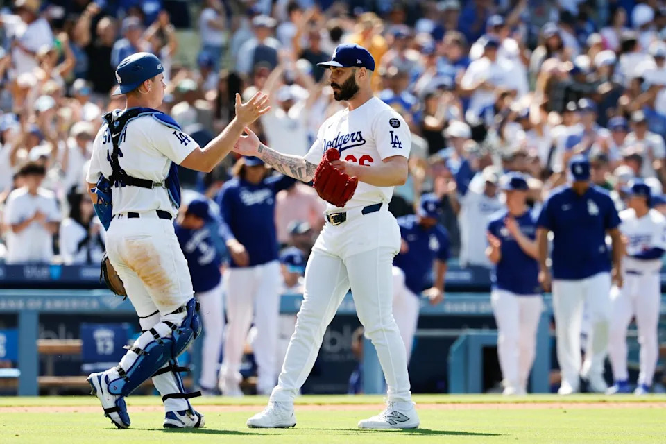 Dodgers pitcher Tanner Scott, right, celebrates Will Smith after closing out a 6-5 win.
