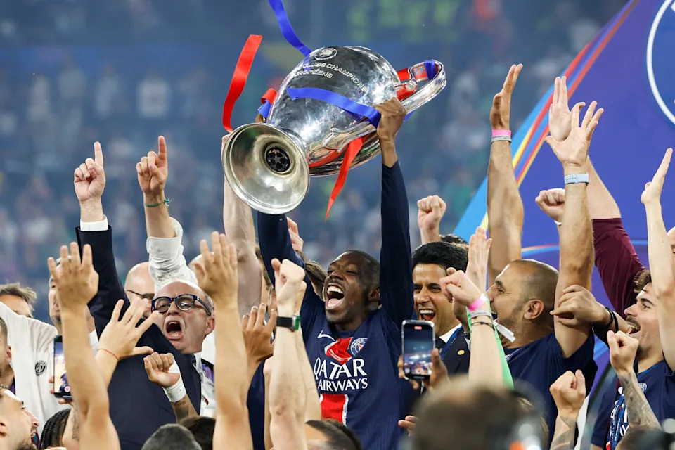 MUNICH, GERMANY - MAY 31: Ousmane Dembele of PSG, PSG President Nasser Al Khelaifi celebrate during the trophy ceremony following the UEFA Champions League Final 2025 between Paris Saint-Germain (PSG) and FC Internazionale Milano (Inter Milan) at Allianz Arena on May 31, 2025 in Munich, Germany. (Photo by Jean Catuffe/Getty Images)