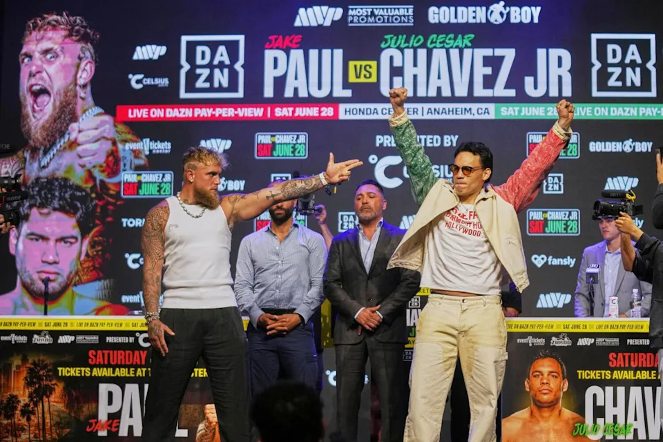 Boxers Jake Paul and Julio César Chávez Jr. attend a news conference at the Avalon Hollywood Theatre in Los Angeles.