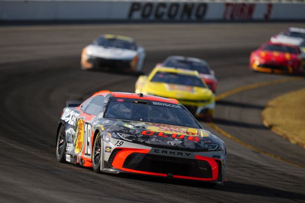 Chase Briscoe drives through Turn 3 during a NASCAR Cup Series auto race at Pocono Raceway, Sunday, June 22, 2025, in Long Pond, Pa. (AP Photo/Derik Hamilton)