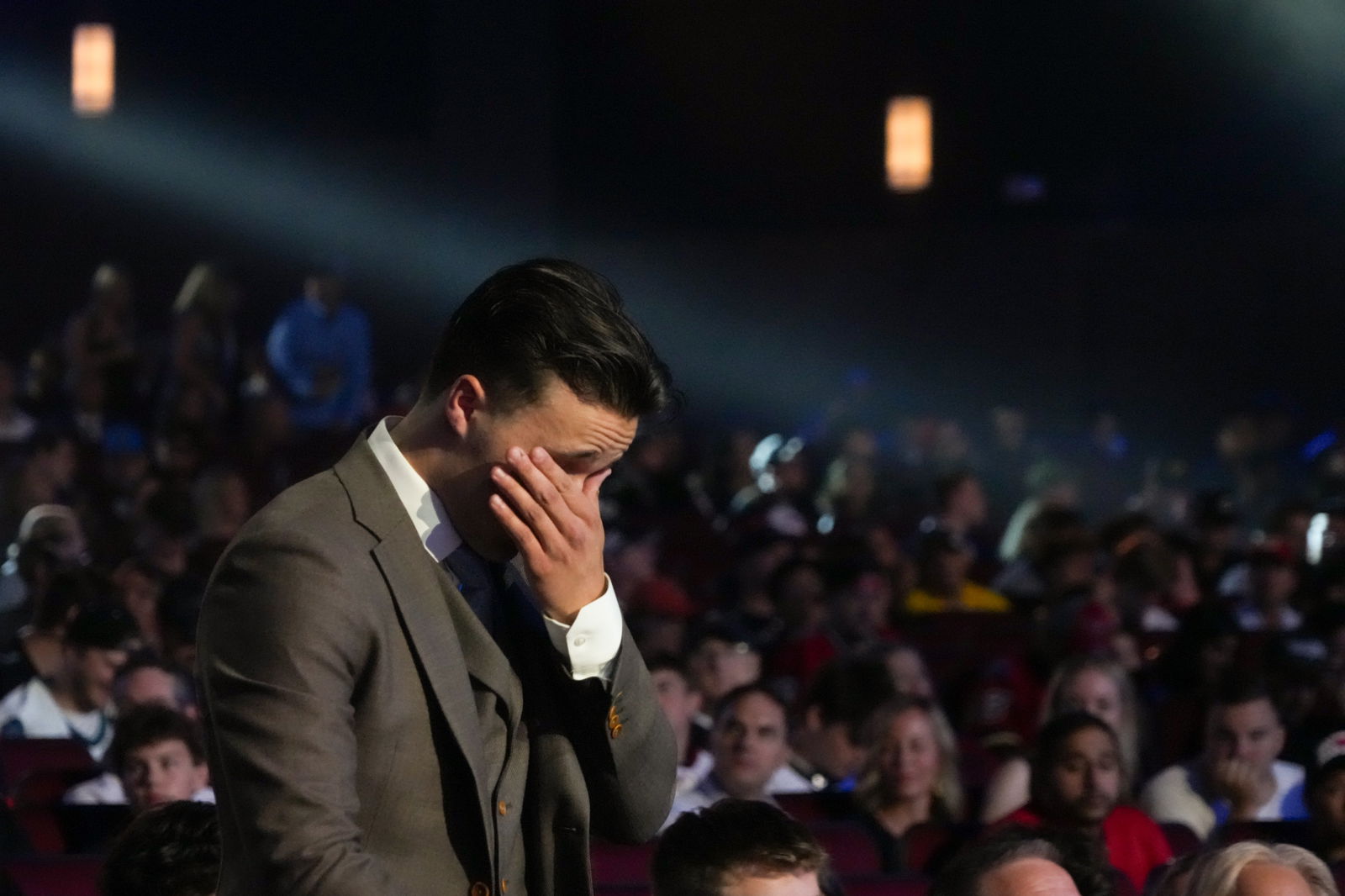 Justin Carbonneau gets emotional after the right wing was selected with the 19th pick of the 2025 NHL Draft by the St. Louis Blues on Friday in Los Angeles. (Kirby Lee-Imagn Images)
