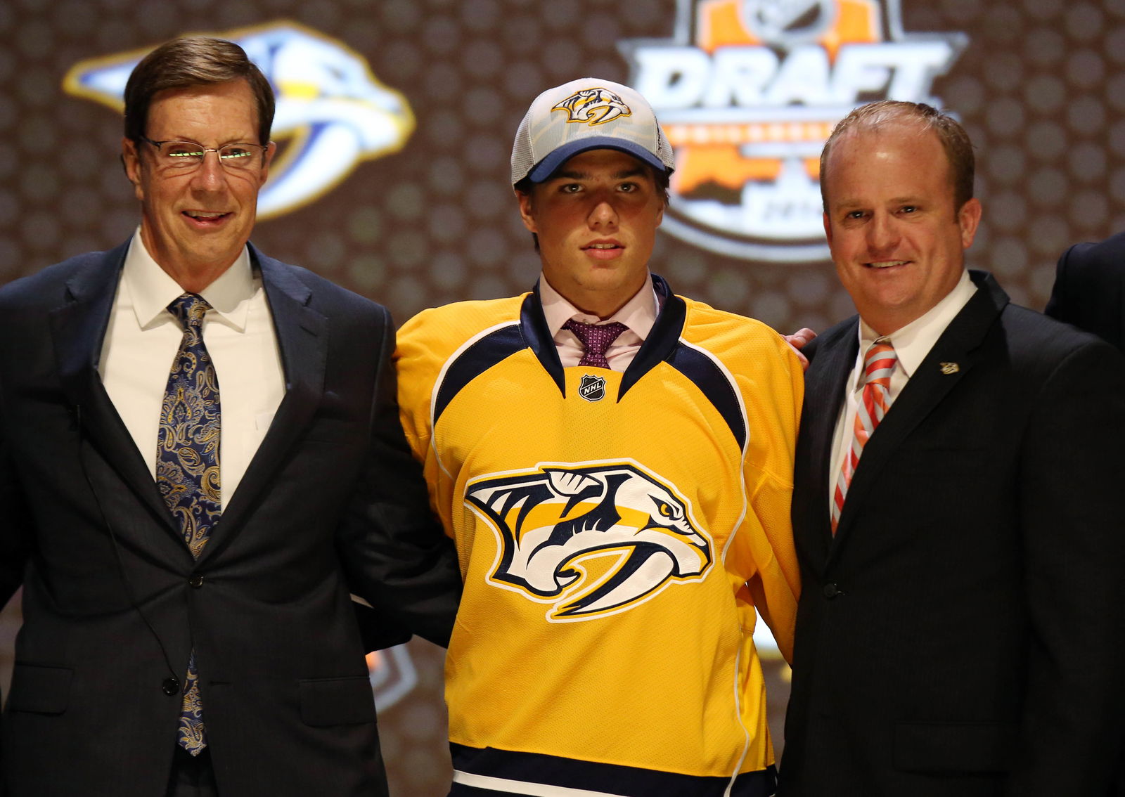 Jun 27, 2014; Philadelphia, PA, USA; Kevin Fiala poses for a photo with team officials after being selected as the number eleven overall pick to the Nashville Predators in the first round of the 2014 NHL Draft at Wells Fargo Center. Mandatory Credit: Bill Streicher-Imagn Images