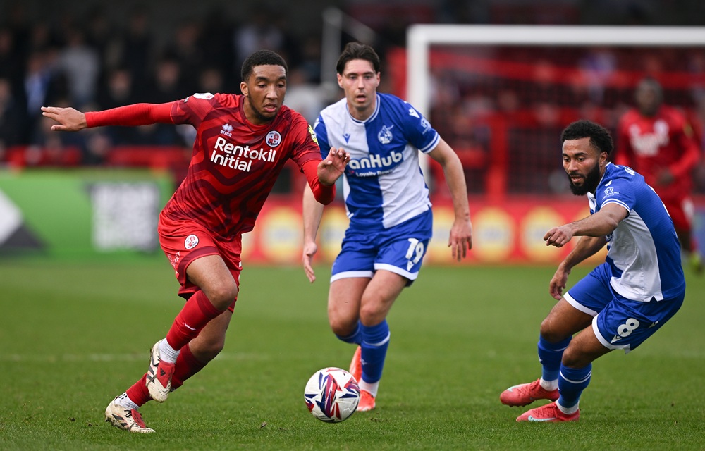 Former Gunner signs for Plymouth Argyle after terrible time in Germany 5 CRAWLEY, ENGLAND: Bradley Ibrahim of Crawley Town is challenged by Isaac Hutchinson and Grant Ward of Bristol Rovers during the Sky Bet League One match between Crawley Town FC and Bristol Rovers FC at Broadfield Stadium on March 22, 2025. (Photo by Mike Hewitt/Getty Images)
