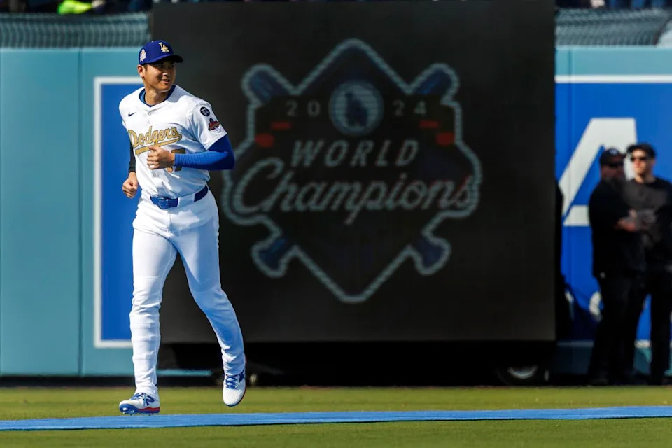 Dodgers two-way player Shohei Ohtani runs onto the field during introductions during the Dodgers' home opener in March.