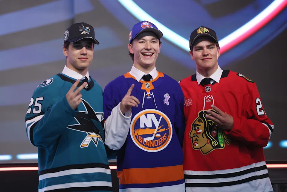 Matthew Schaefer stands between Michael Misa, left, and Anton Frondell after being selected 1-2-3 in the NHL draft.