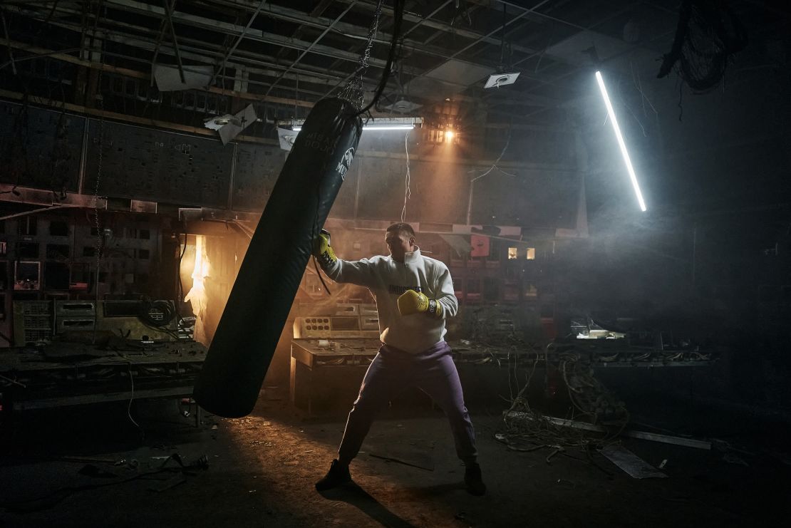 Usyk hits a punch bag in a devastated energy plant in central Ukraine to hear stories of survival and resilience from frontline workers who are keeping the lights on for Ukraine on March 17.