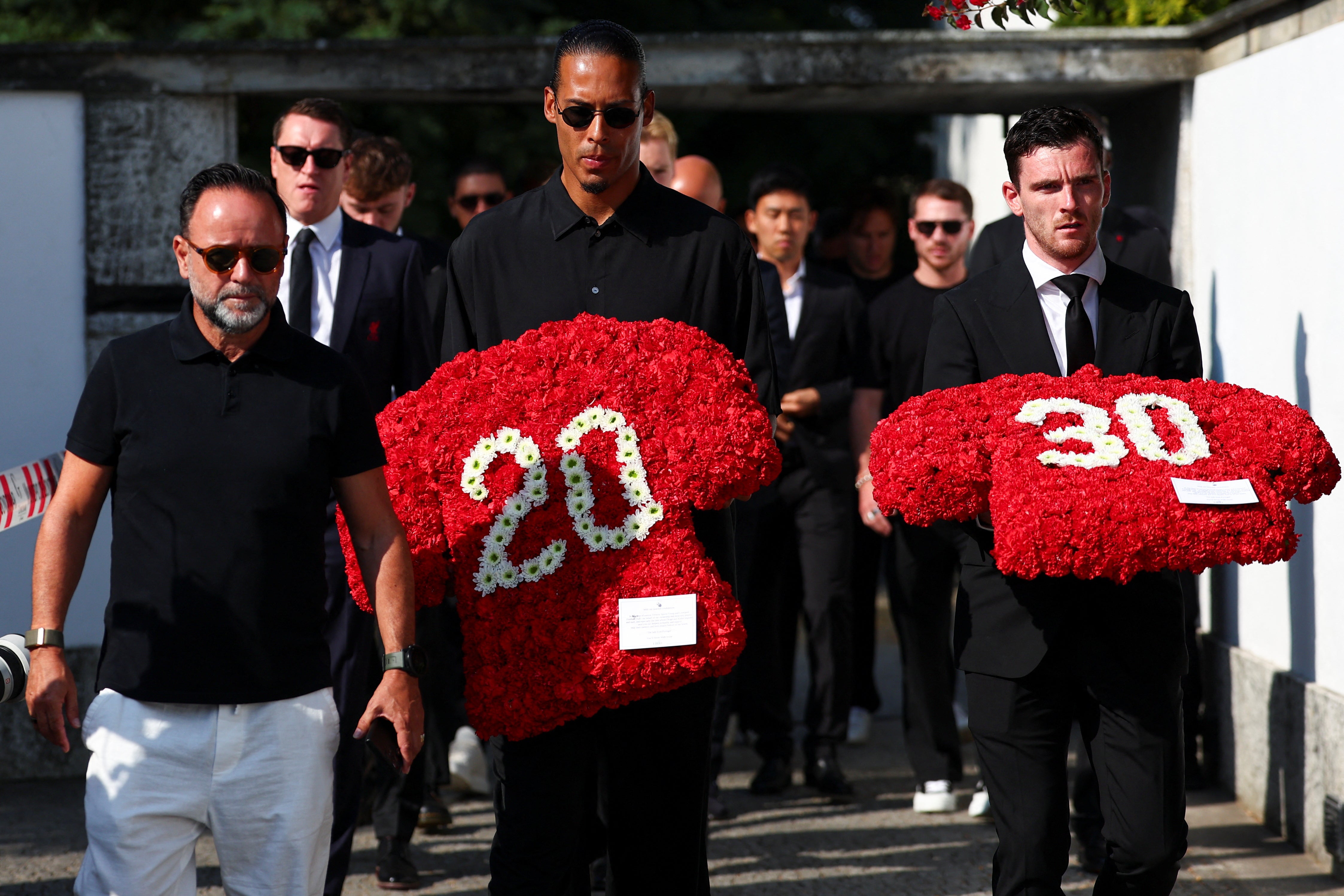Liverpool's captain Virgil van Dijk and Liverpool's player Andrew Robertson arrive at the funeral