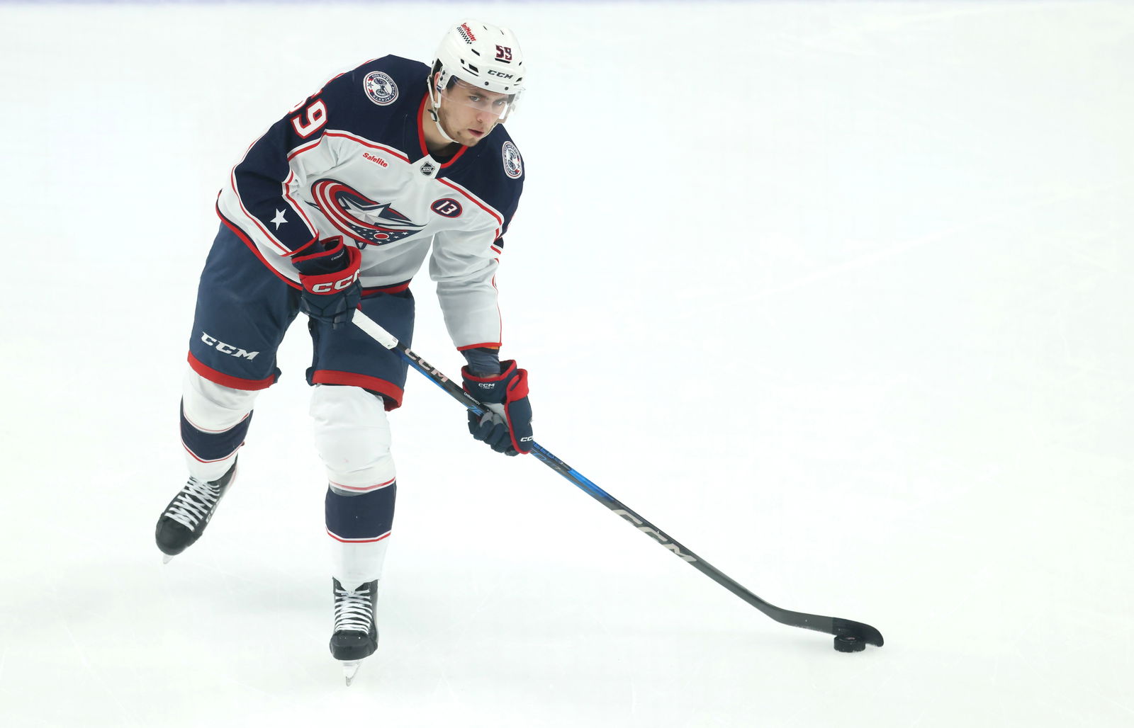 Mar 21, 2025; Pittsburgh, Pennsylvania, USA; Columbus Blue Jackets right wing Yegor Chinakhov (59) warms up before the game against the Pittsburgh Penguins at PPG Paints Arena. Mandatory Credit: Charles LeClaire-Imagn Images