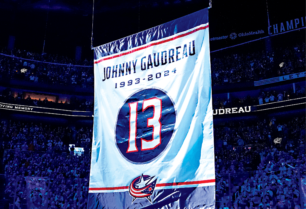 A banner is raised in honor of Johnny Gaudreau on Oct. 15, 2024. (Samantha Madar/USA Today Network via Imagn Images)