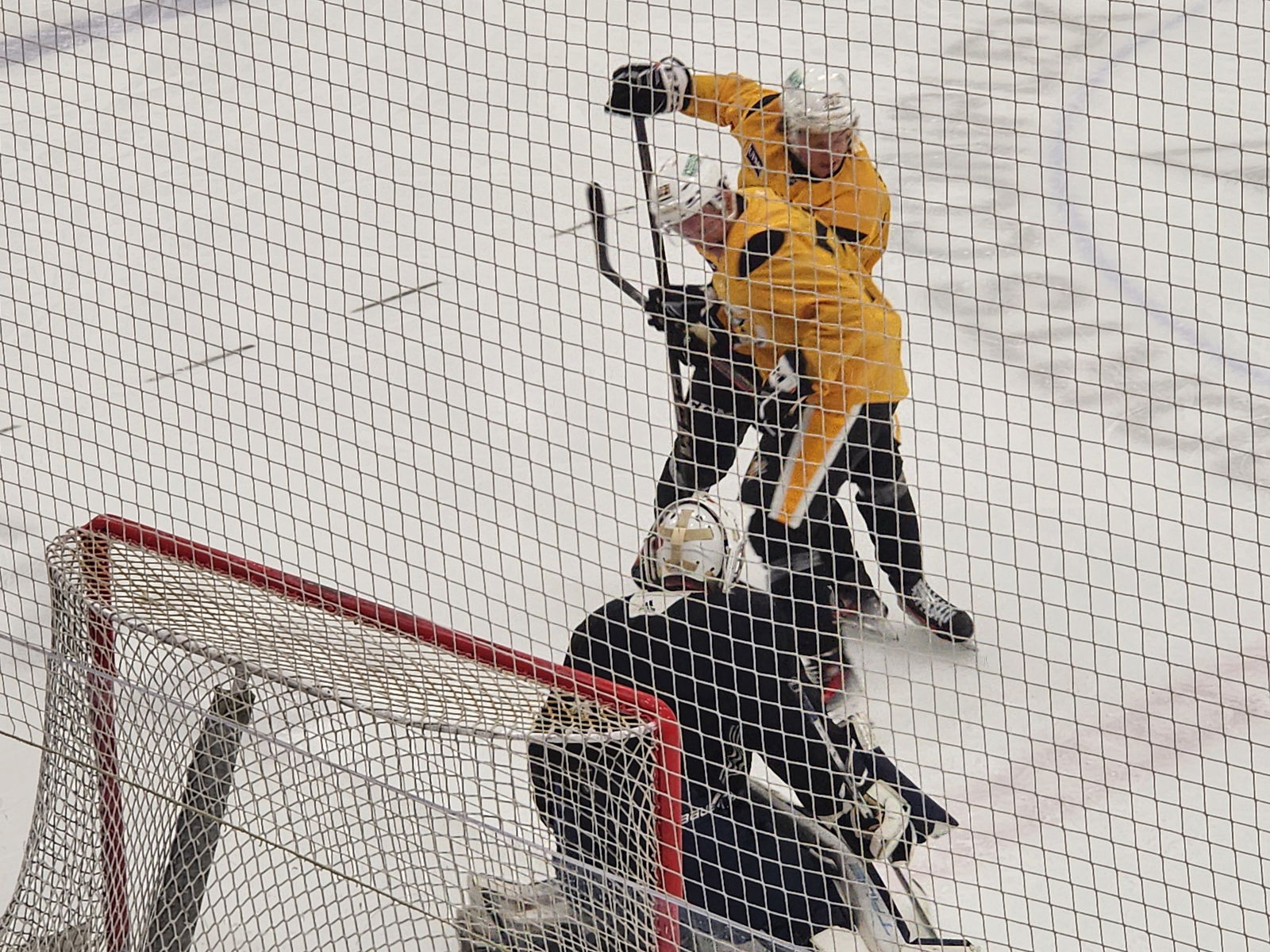 Penguins' 2025 fourth-round pick Travis Hayes (front) battles for positioning at the net front. (Credit: Kelsey Surmacz - The Hockey News)