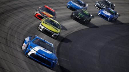 Denny Hamlin outlasts weather, old tires