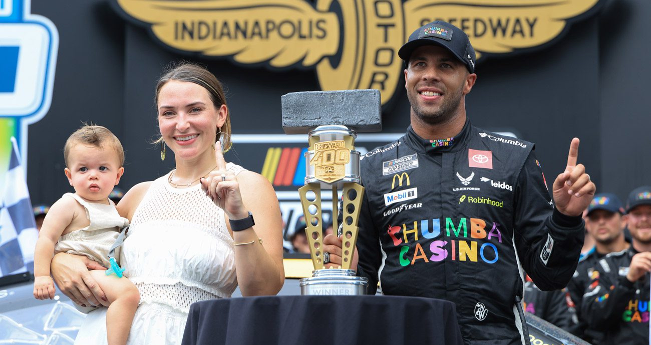Bubba Wallace celebrates his Brickyard 400 win with wife Amanda and son Becks.