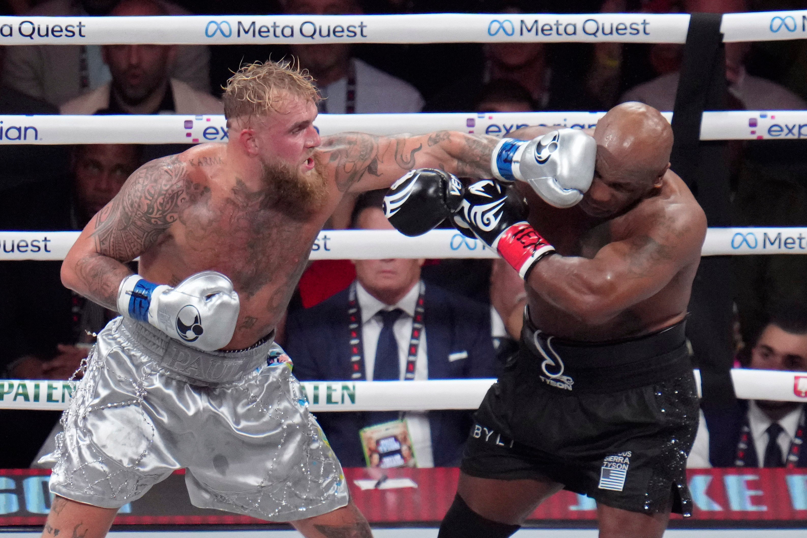 Jake Paul (left) and Mike Tyson in action in November