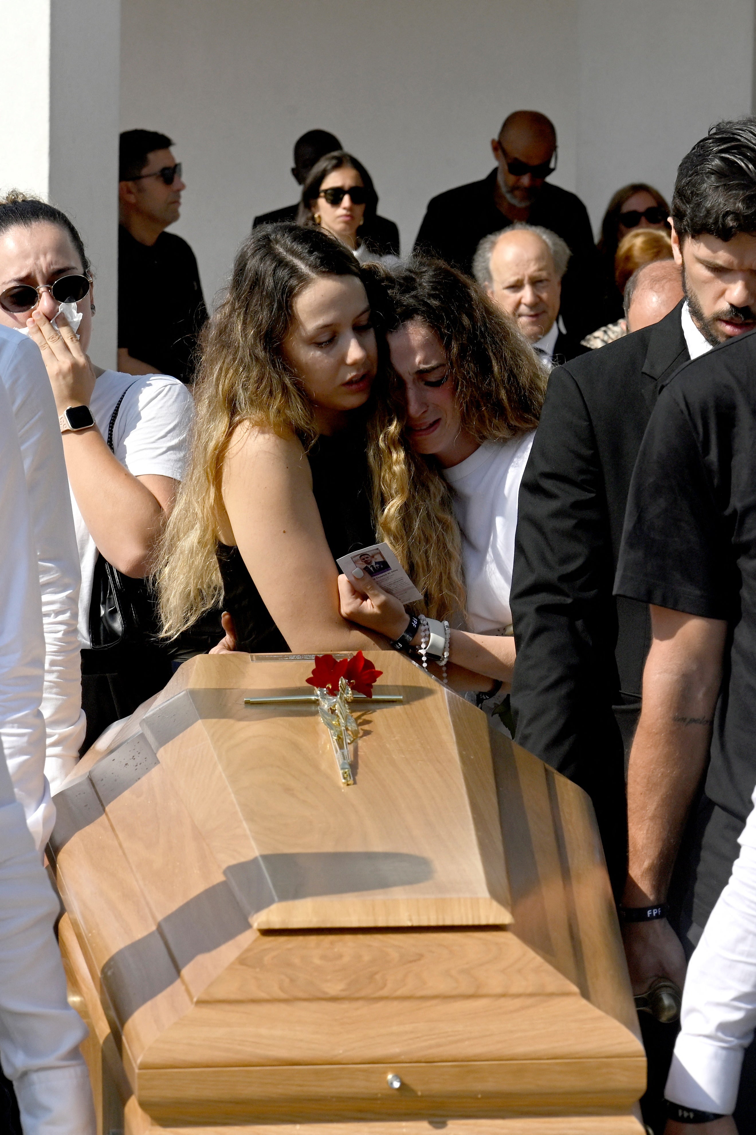 Diogo Jota’s wife Rute Cardoso (right) and her sister react as pallbearers carry the coffin