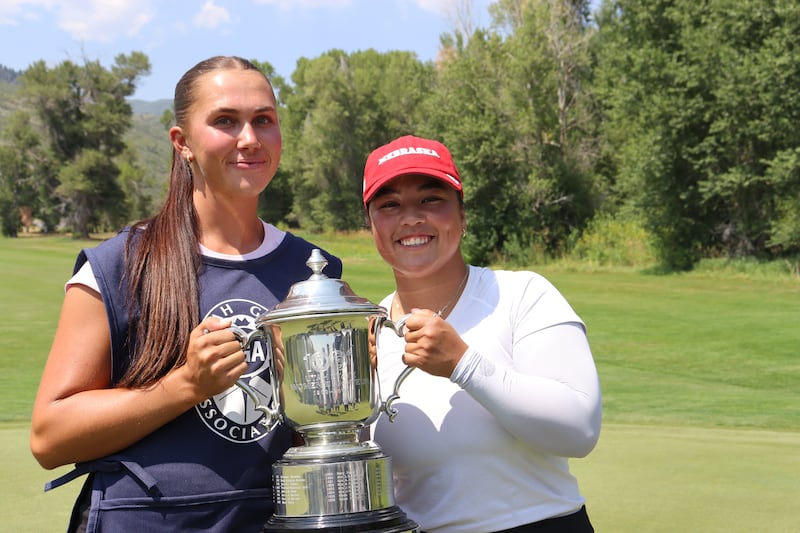 Utah Women's State Am champion Arden Aline Louchheim, right, poses with the trophy with her caddie Berlin Long at Wasatch Mountain State Park Golf Course in Midway, Utah, on Thursday, July 24, 2025.