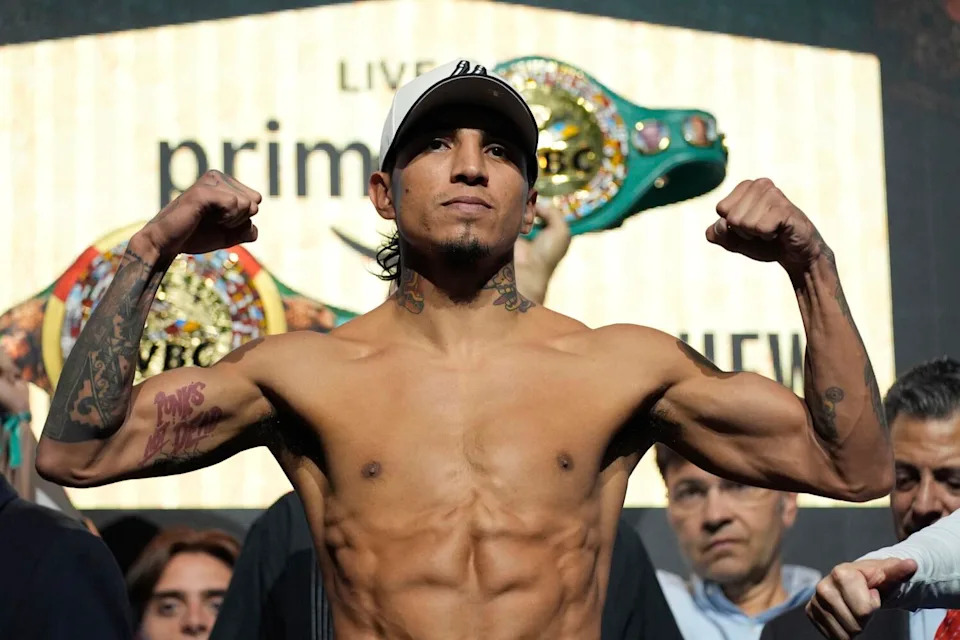 WBC welterweight champion Mario Barrios poses on the scale at a ceremonial weigh-in on Friday in Las Vegas.