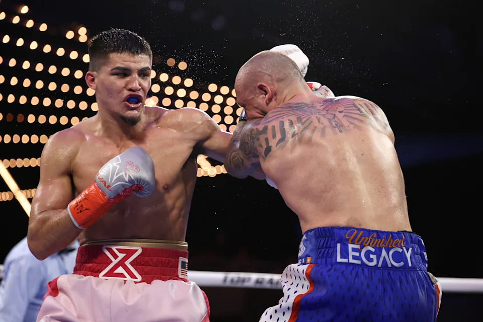 NEW YORK, NEW YORK - FEBRUARY 14:  Xander Zayas punches Slawa Spomer during their junior middleweight fight during their junior bantamweight fight during their lightweight fight during their welterweight fight, during their heavyweight fight at The Theater at Madison Square Garden on February 14, 2025 in New York City. (Photo by Al Bello/Getty Images)