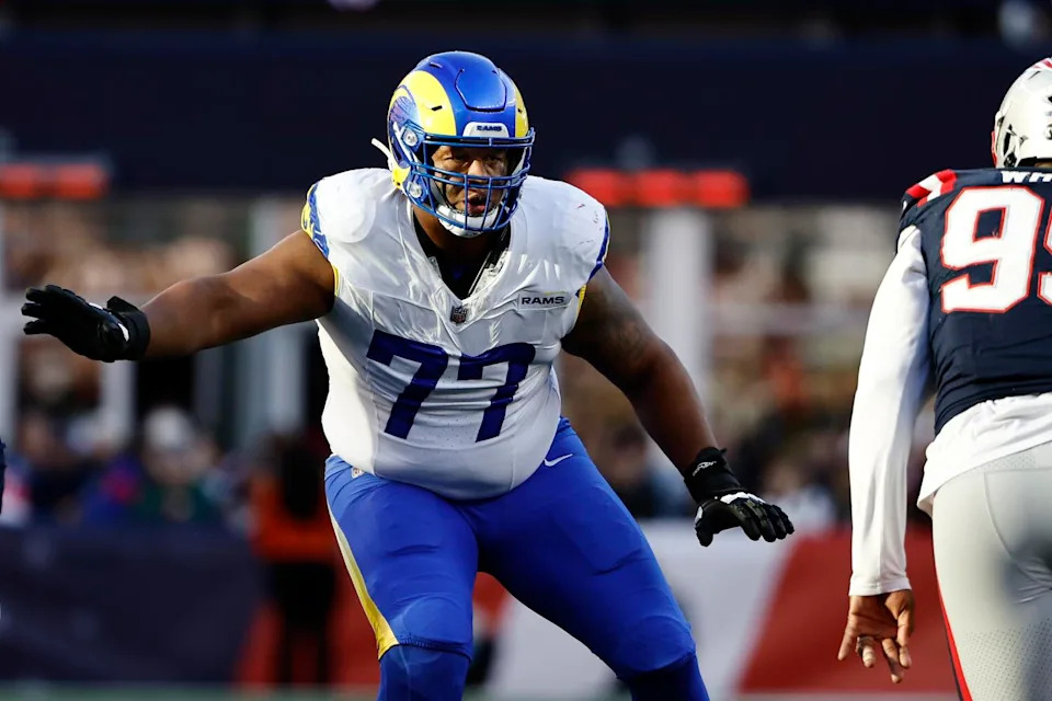 Rams offensive tackle Alaric Jackson comes up from his stance in preparation to block.