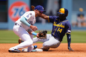 Brewers tie Cubs for first place with 10th straight win, while slumping Dodgers lose Freddie Freeman to wrist contusion